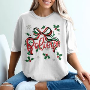 Believe Christmas T-Shirt, Holiday Cheer Shirt, Festive Graphic Tee, Xmas Ribbon Holly Design, Winter Snowflakes, Seasonal Gift Tee, Joyful