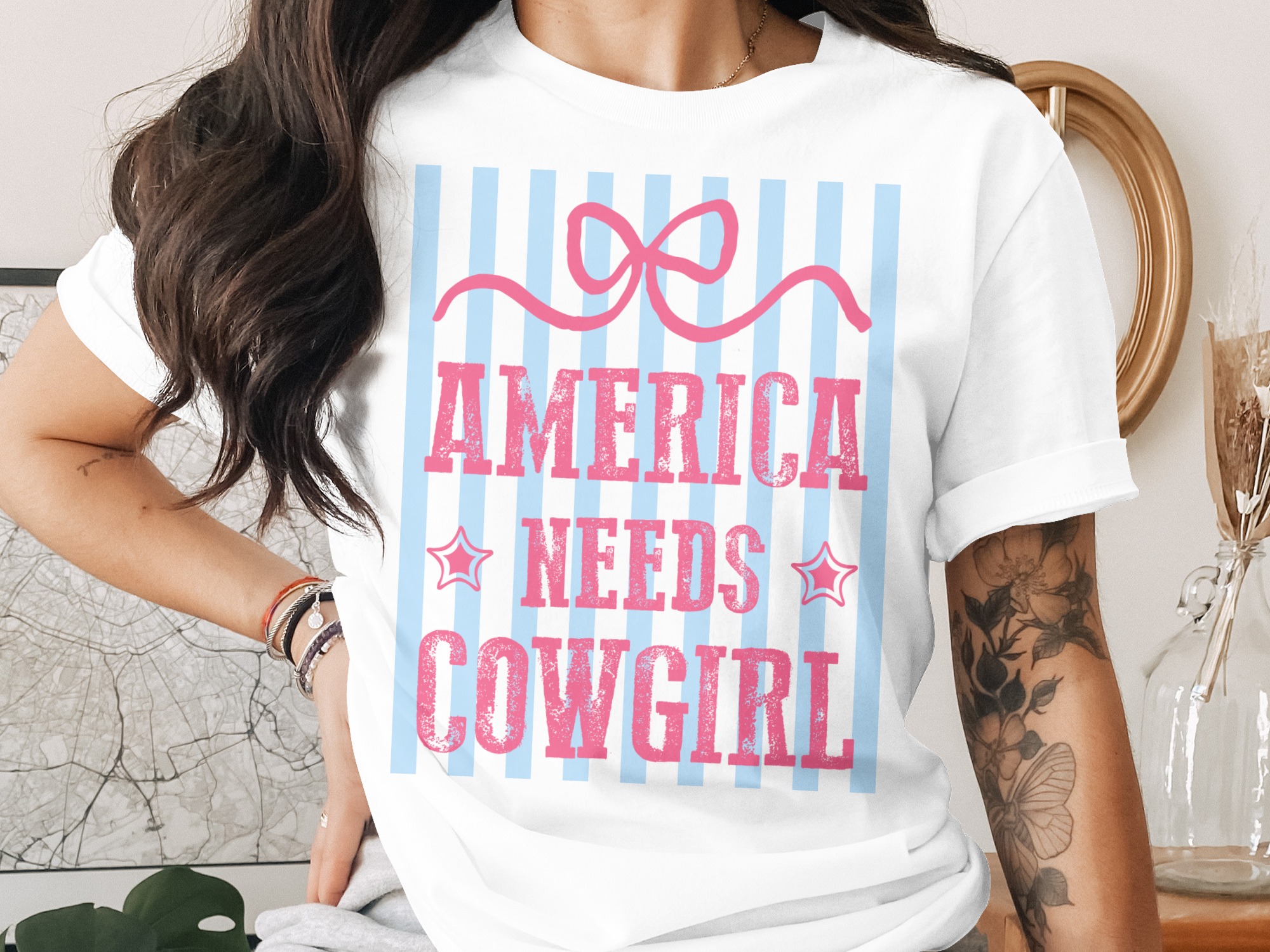 America Needs Cowgirl T-Shirt, Patriotic Western Graphic Tee, Distressed Pink Bow Shirt, Girly Americana Rodeo Top, Gift For Her